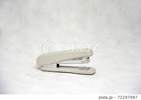 Grey color of Stapler isolated on white fabric background. Grey color of Stapler isolated on white fabric background. 72297997