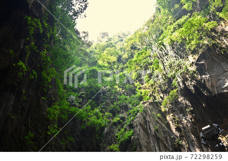 Batu Caves inside a limestone hill that has a series of caves and cave temples Batu Caves inside a limestone hill that has a series of caves and cave temples 72298259