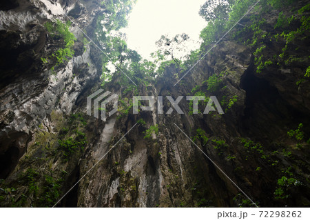 Batu Caves inside a limestone hill that has a series of caves and cave temples Batu Caves inside a limestone hill that has a series of caves and cave temples 72298262