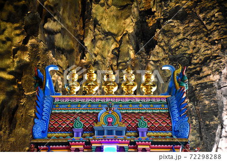 Batu Caves inside a limestone hill that has a series of caves and cave temples Batu Caves inside a limestone hill that has a series of caves and cave temples 72298288