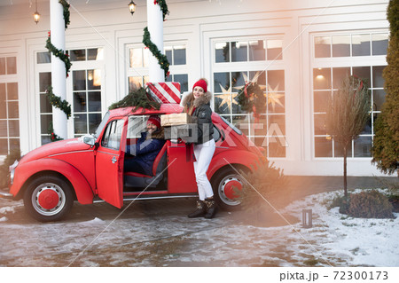 Young couple buys Christmas presents for their 72300173