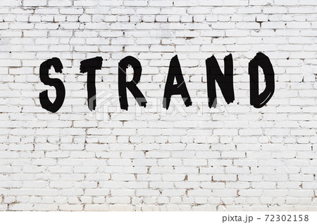 Word strand painted on white brick wall Word strand painted on white brick wall 72302158