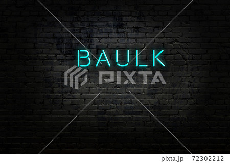 Night view of neon sign on brick wall 72302212