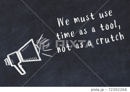 Chalk loudspeaker and wise quote on black desk Chalk loudspeaker and wise quote on black desk 72302268