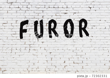 Word furor painted on white brick wall 72302331