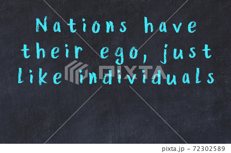 Black chalkboard with wise inscription on it Black chalkboard with wise inscription on it 72302589