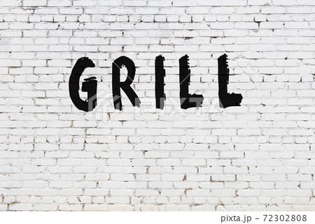 Word grill painted on white brick wall Word grill painted on white brick wall 72302808