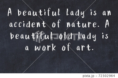 Chalk wise inscription on black chalkboard 72302964