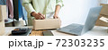 Business owner entrepreneur packing cardboard box preparing parcel for shipment, Online marketing.. 72303235