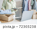 Business owner entrepreneur packing cardboard box preparing parcel for shipment, Online marketing.. 72303238