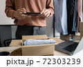 Business owner entrepreneur packing cardboard box preparing parcel for shipment, Online marketing.. 72303239