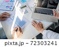 Business Startup team discussing on data report documents at modern workplace.. 72303241