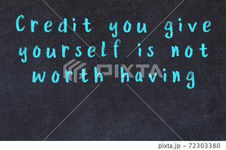 Black chalkboard with wise inscription on it 72303380