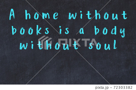 Chalk wise inscription on black chalkboard 72303382