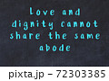 Chalk inscription of smart quote on black desk 72303385