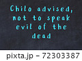 Chalk wise inscription on black chalkboard 72303387