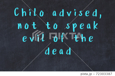 Chalk wise inscription on black chalkboard 72303387