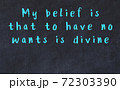 Chalk inscription of smart quote on black desk 72303390