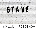 Word stave painted on white brick wall 72303400