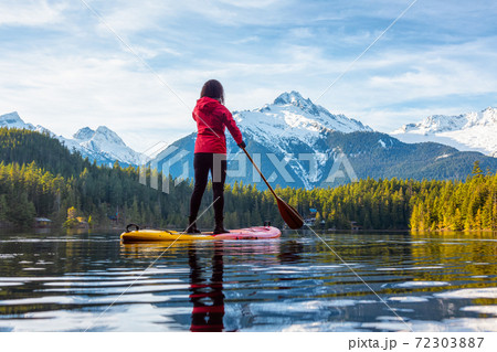 Adventurous Girl Paddle Boarding on Levette Lak Adventurous Girl Paddle Boarding on Levette Lak 72303887