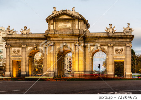 Puerta de Alcala in Madrid at sunset during Christmas Puerta de Alcala in Madrid at sunset during Christmas 72304675