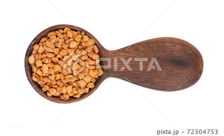 Fenugreek seeds in wooden spoon, isolated on white background. Shambala, helba seeds. Top view. Fenugreek seeds in wooden spoon, isolated on white background. Shambala, helba seeds. Top view. 72304753