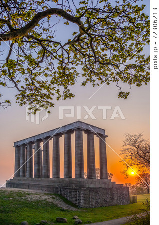 View of National Monument of Scotland against sunset on Calton Hill in Edinburgh, Scotland View of National Monument of Scotland against sunset on Calton Hill in Edinburgh, Scotland 72306213