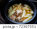 Braised potato with pieces of turkey meat with spices in a pan is ready to eat 72307351