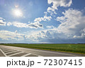Asphalt highway with road markings on the background of blue sky and clouds 72307415