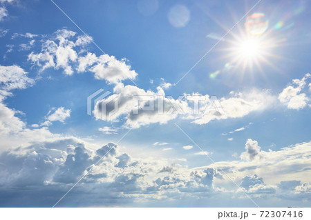 Beautiful fluffy clouds on a blue sky background on a sunny day Beautiful fluffy clouds on a blue sky background on a sunny day 72307416