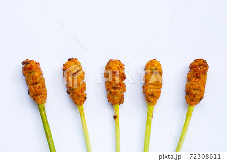 Grilled minced chicken with curry paste and coconut cream on lemongrass skewers. Top view 72308611