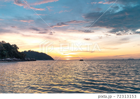 Evening sky and boat on the island Evening sky and boat on the island 72313153