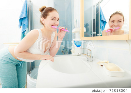 Woman brushing cleaning teeth. Oral hygiene. Woman brushing cleaning teeth. Oral hygiene. 72318004