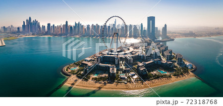 Ain Dubai ferris wheel on Bluewaters island with amazing Dubai skyline in the UAE Ain Dubai ferris wheel on Bluewaters island with amazing Dubai skyline in the UAE 72318768