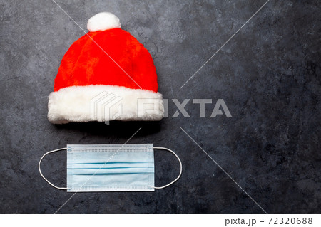 Christmas card with santa hat and face mask 72320688