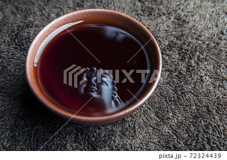 image of tea cup buddha reflection 72324439
