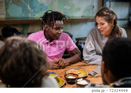 Close up of highschool students having a snack in a modern cafe 72324449