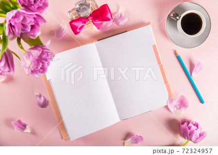 Open Notebook for writing Dreams and Ideas with flowers nearby Open Notebook for writing Dreams and Ideas with flowers nearby 72324957