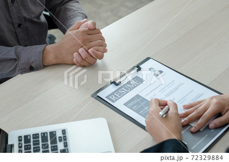 Business people hold a resume and talk to job applicants for job interviews about careers and Her personal history in the company. Recruitment concepts 72329884