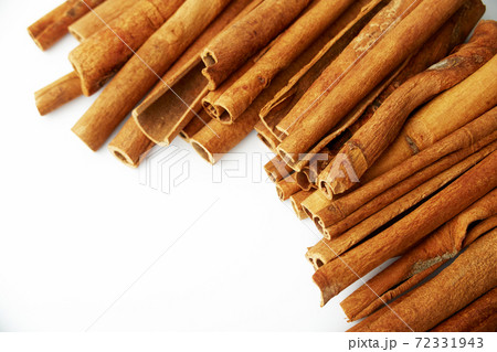 Cinnamon close up on a white background Cinnamon close up on a white background 72331943