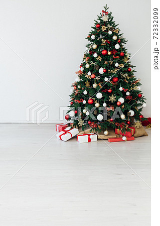 White Christmas tree decor with gifts garland interior new year 72332099
