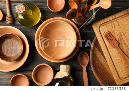 Different wooden kitchenware on wooden table, top view 72333528