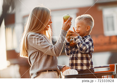 Mother with baby boy going shopping Mother with baby boy going shopping 72333928