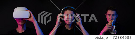 Portrait of gamer in VR, in gaming garniture and in snack break. Concept of I don't see, I don't hear, I don't speak. Portrait of gamer in VR, in gaming garniture and in snack break. Concept of I don't see, I don't hear, I don't speak. 72334682