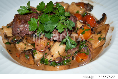 Gnocchi with beef and vegetables . Gnocchi with beef and vegetables . 72337327