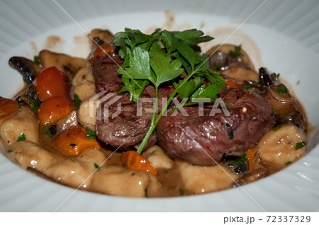 Gnocchi with beef and vegetables . Gnocchi with beef and vegetables . 72337329