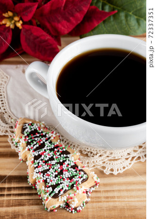 Cup of coffee with christmas tree cookies Cup of coffee with christmas tree cookies 72337351
