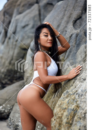 Beautiful hispanic girl in a white bikini Stock Photo