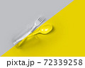 Plastic cup, fork, spoon on color 2021 72339258