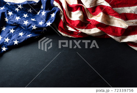 Martin Luther King Day celebrated concept. American flag against wooden background 72339756